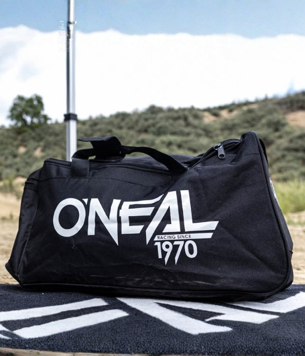 Black duffel bag with 'O'Neal' logo on a mat outdoors collection