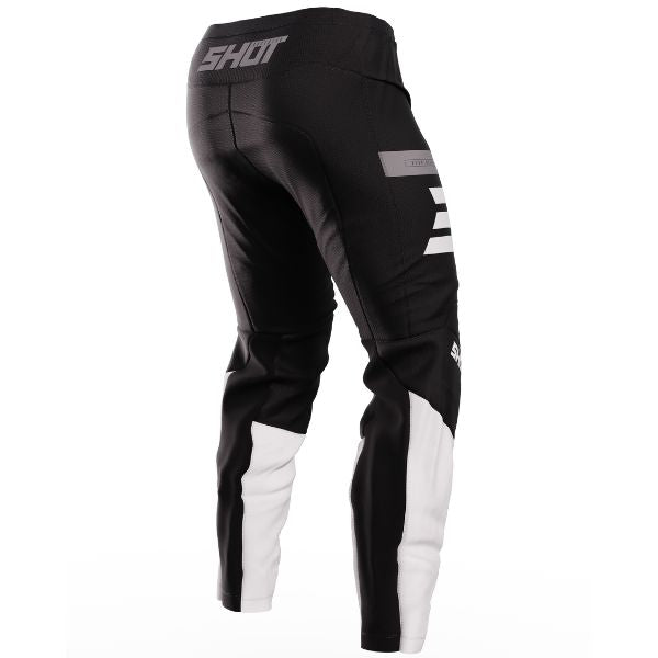 Back view, Reflex Pants black—600D shell with poly-stretch inserts, leather knee heat panels, non-slip waist. Sizes 28–42. SKU A08-11C1-A01-30.