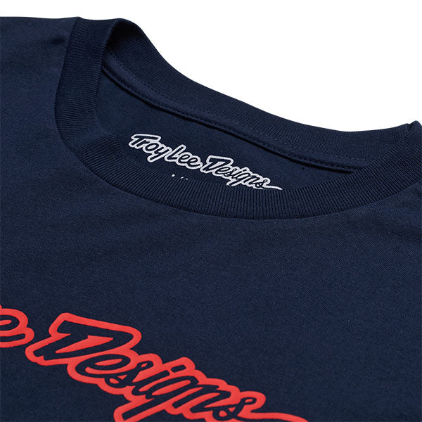 Studio photo on a white background of Troy Lee Designs Signature Long Sleeve Tee; showing long-sleeve cut, printed graphics, and crew neckline