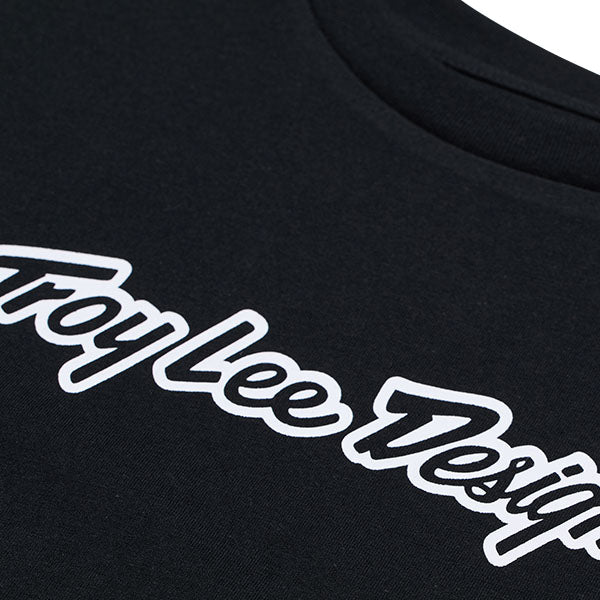 Professional studio photo of Troy Lee Designs Signature Tee (Womens); showing tee fit, printed graphics, and crew neckline; SKU 7539170; Sizes: S-XL