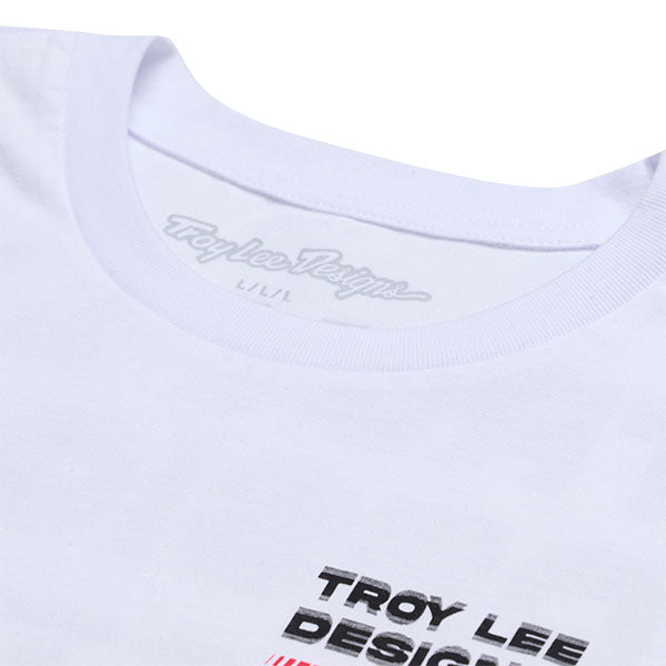 Professional studio photo of Troy Lee Designs Factory Tee; showing tee fit, printed graphics, and crew neckline; SKU 7018180; Colors: White, Black