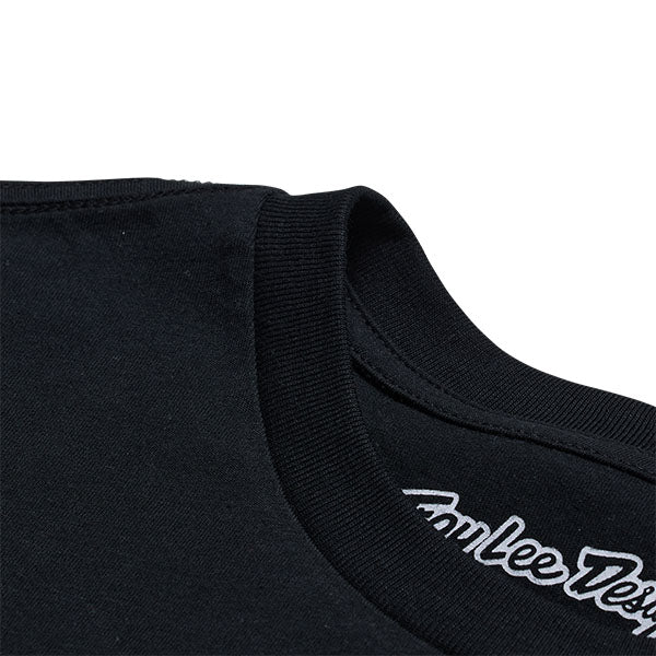 Clean studio shot of Troy Lee Designs Factory Tee; showing tee fit, printed graphics, and crew neckline; SKU 7018180; Colors: White, Black; Sizes: S-2XL