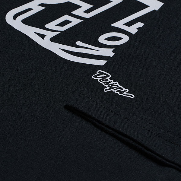 High-resolution studio image of Troy Lee Designs Badge Tee; showing tee fit, printed graphics, and crew neckline; SKU 701568102; Sizes: S-2XL