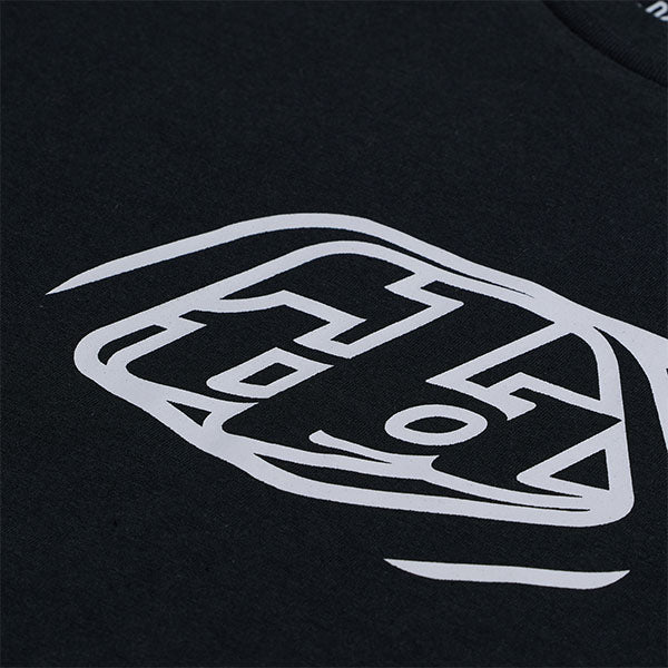 Professional studio photo of Troy Lee Designs Badge Tee; showing tee fit, printed graphics, and crew neckline; SKU 701568102; Sizes: S-2XL