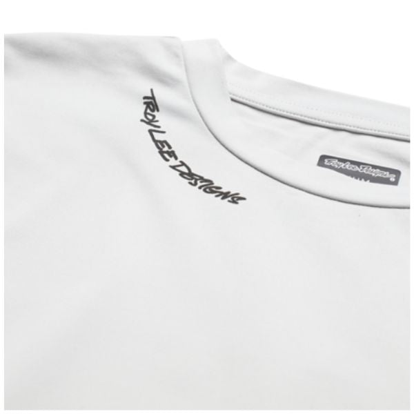 Studio photo on a white background of Troy Lee Designs Ruckus LS Ride Resist Tee (MTB); showing long-sleeve cut, printed graphics, and crew neckline