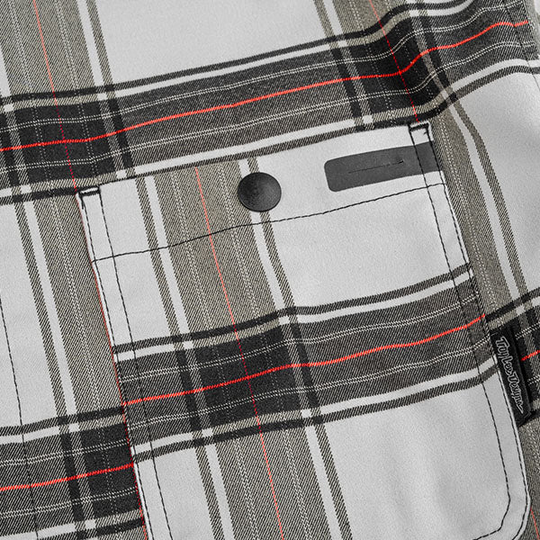 Studio photo on a white background of Troy Lee Designs Grind YD Plaid Flannel; showing flannel shirt fit, button front, and plaid pattern; SKU 8276500