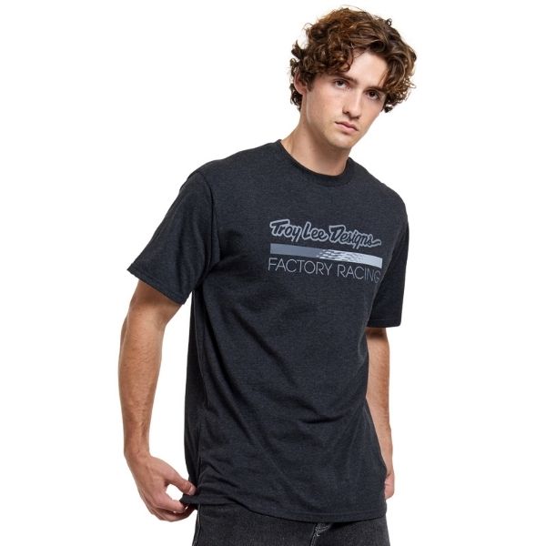 High-resolution studio image of Troy Lee Designs Factory Racing Tee; showing tee fit, printed graphics, and crew neckline; SKU 7016690; Sizes: S-2XL