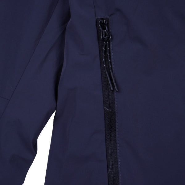 Troy Lee Designs Skyline Pro Mono mountain bike jacket in Carbon, worn by a rider from the rear, showing the hood, back fit, and panel layout