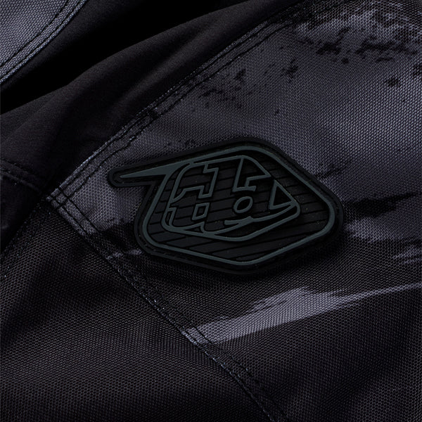 Professional studio photo of Troy Lee Designs - Scout GP Pro Slab Pants; showing panel layout, seams, and overall cut; SKU 2918660; Colors: Black, Timber