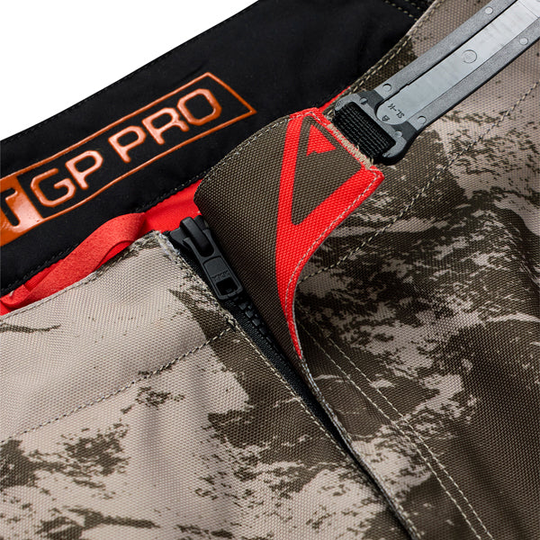 Professional studio photo of Troy Lee Designs - Scout GP Pro Slab Pants; showing panel layout, seams, and overall cut; SKU 2918660; Colors: Black, Timber