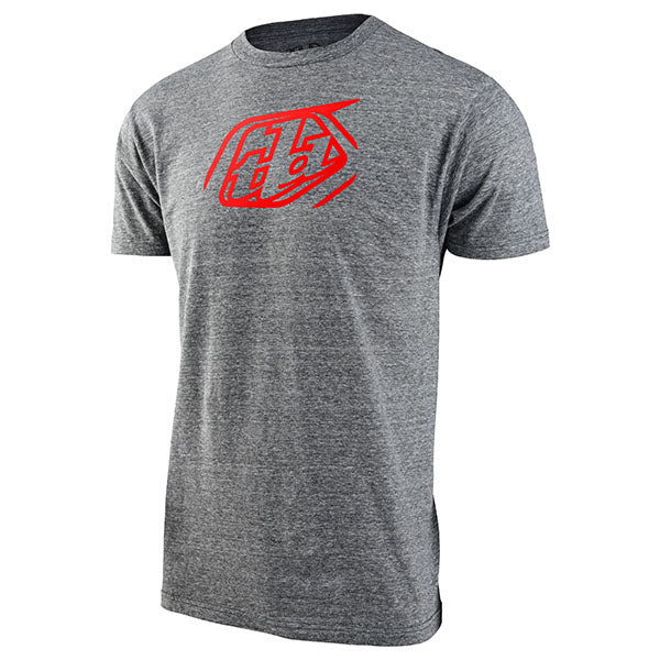Crisp studio image on a white background of Troy Lee Designs Badge Tee; showing tee fit, printed graphics, and crew neckline; SKU 7015680; Sizes: S-2XL