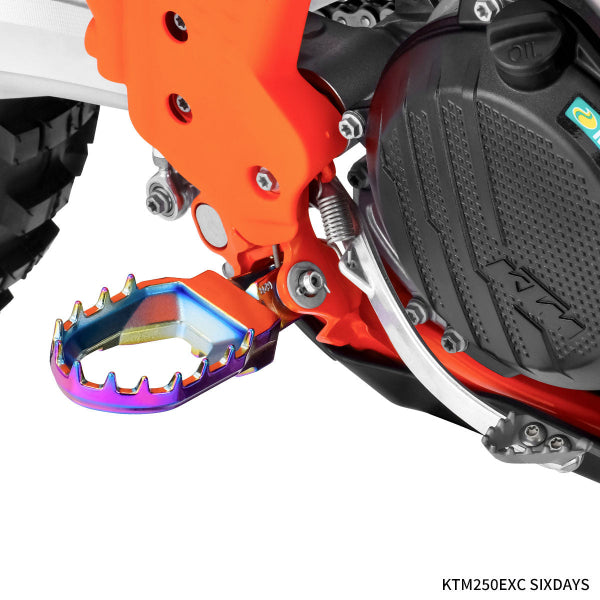 High-resolution studio image of Zeta - Max Footpegs (Husqvarna); showing overall shape and visible design details; SKU 634-26; Colors: Black, Multicolor