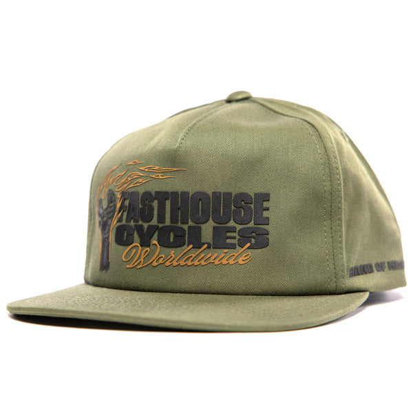 SKU 3210050 – Fasthouse Spanner Hat in olive green, front angle view showing “Fasthouse Cycles Worldwide” embroidered logo with flaming wrench graphic, flat bill design, popular with motocross and dirt bike riders.