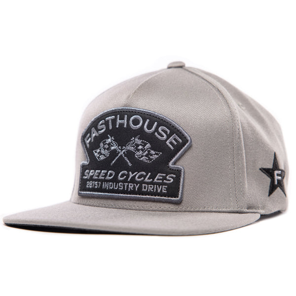 Fasthouse Crown hat, SKU 3210150. Front view of a grey snapback hat with a black and grey embroidered patch. The patch features the text