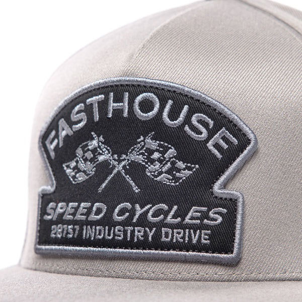 Close-up of the embroidered front patch on the Fasthouse Crown hat, SKU 3210150. The patch reads