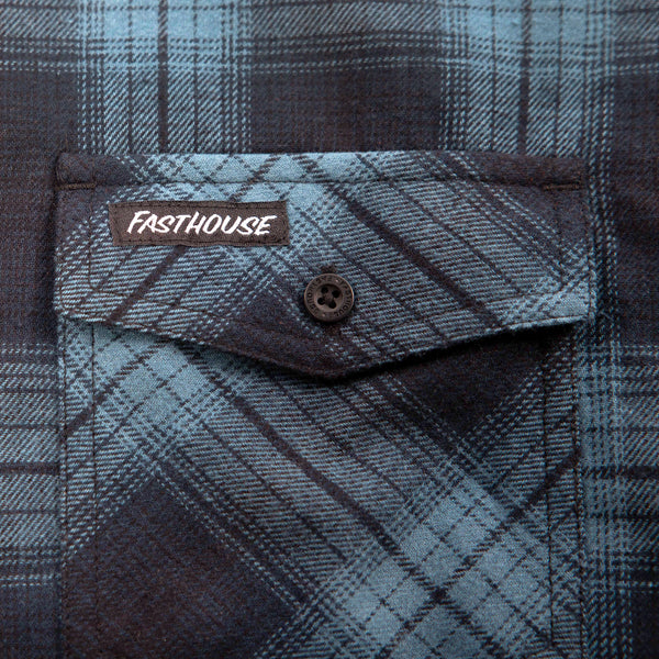 Studio photo on a white background of Fasthouse; showing flannel shirt fit, button front, and plaid pattern; SKU 3297920207