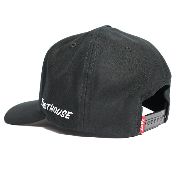 Rear view of Fasthouse WIRED Hat in black (SKU 3297960500) with adjustable snapback closure, side embroidery reading “Fasthouse,” and red woven tag, motocross inspired streetwear cap.