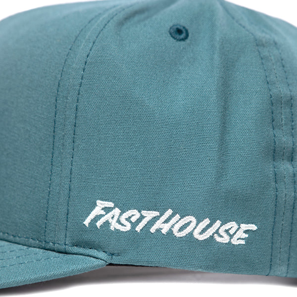 Side view of Fasthouse Wired Hat SKU 3321098 in teal, showing white embroidered Fasthouse logo above the brim, durable moto lifestyle snapback cap.