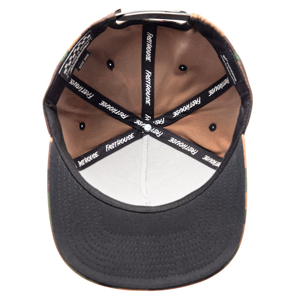 Inside view of Fasthouse Wired Hat SKU 3321098 showing camo panels, black sweatband, and branded interior taping with repeated Fasthouse logo, built for motocross comfort and durability.