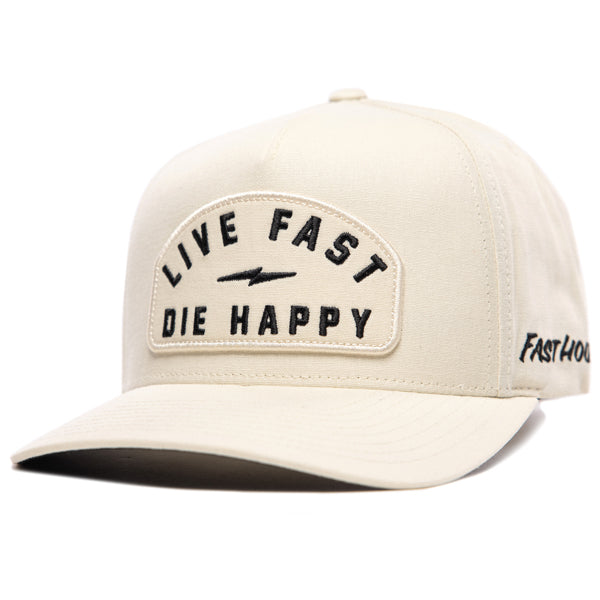 Fasthouse Wired Hat SKU 3321098 in chalk white, structured front panel with embroidered patch that reads “Live Fast Die Happy” and a small lightning bolt, motocross lifestyle snapback cap angled view.