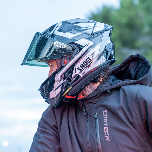 man wearing black and white shoei helmet looking left collection