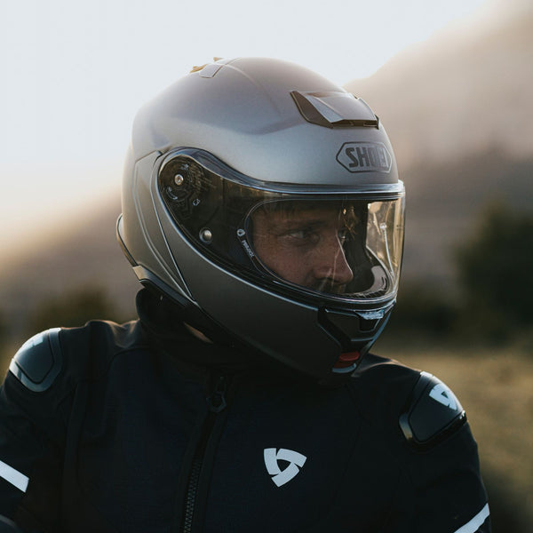 man wearing gray shoei helmet looking right collection
