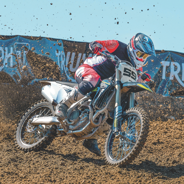 man riding a dirt bike wearing a shoei helmet collection