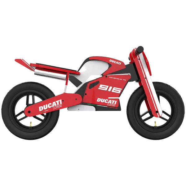 Kiddimoto Ducati Desmo GP25 wooden balance bike shown from the opposite side, featuring a red MotoGP-inspired body, black spoke wheels, black pneumatic tires, black seat and handlebars, white accents, and Ducati racing sponsor logos. SKU 6391000150, UPC 5060840317954.