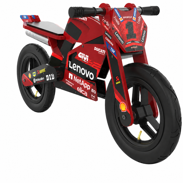 Kiddimoto Ducati Desmo GP25 wooden balance bike in a side view, with a red MotoGP-style frame, black pneumatic tires, black seat and grips, and Ducati sponsor graphics. SKU 6391000150, UPC 5060840317954.