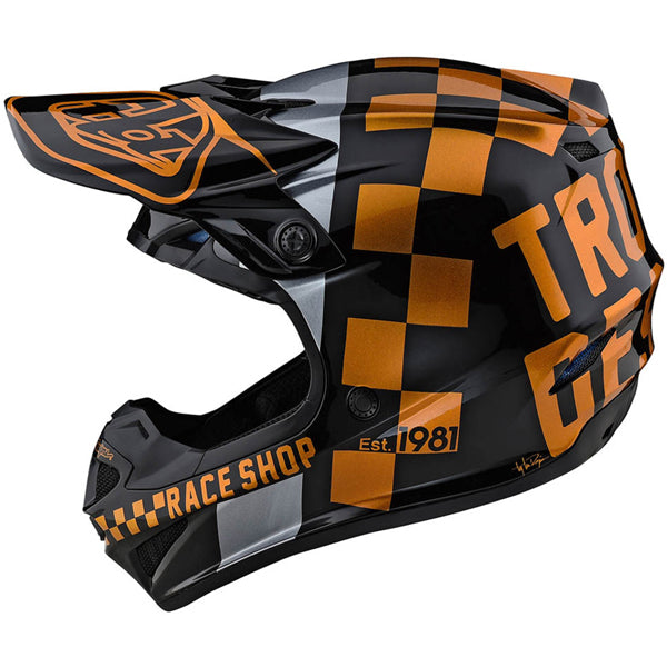Image of Troy Lee Designs SKU 1090440 SE4 Polyacrylite Checkers Helmet Size: XS Colors: Black / Gold (SKU 1090440)