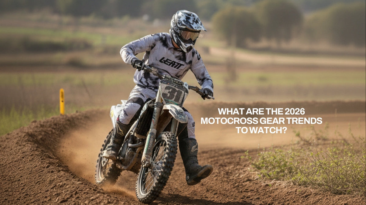 A motocross rider wearing a Leatt Moto Jersey and pants cornering through a dusty turn on a dirt track. With "what are the 2026 Motocross Gear Trends to Watch?" written above