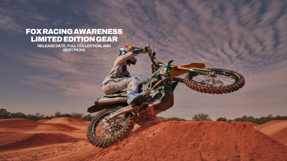 Ken Roczen performing a wheelie on a Suzuki motocross bike in Fox Racing Awareness Limited Edition Gear.