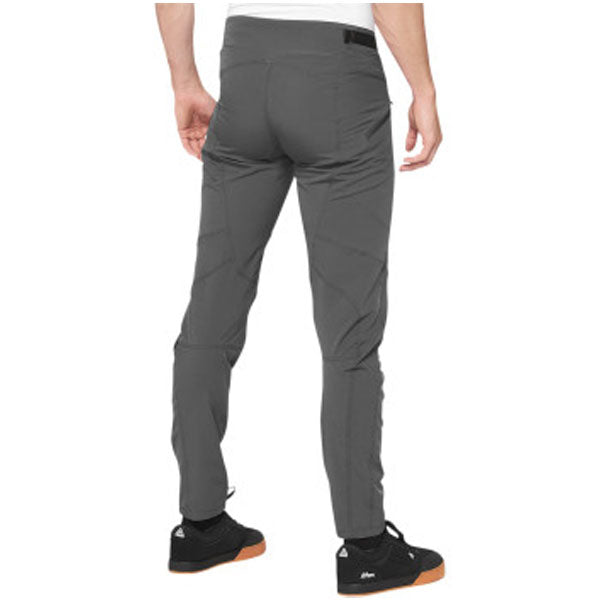 Catalog studio image of 100%, Airmatic Pants (MTB), SKU 50100050, color options Black, Charcoal, sizes 28–38, Designed for Mountain Bike, BMX and E-Bike riders