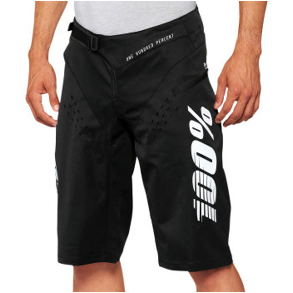 High-resolution studio image of 100%, R-Core Shorts (MTB), SKU 50010159, color Black, sizes 28–38, Designed for Mountain Bike, BMX and E-Bike riders