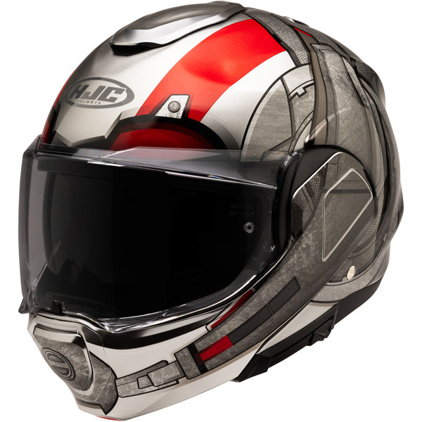 A full-face motorcycle helmet with a sleek, aerodynamic design featuring a glossy finish in white, red, and black colors. The helmet has a clear visor covering the front, with black trim around the edges, and a prominent HJC logo on the forehead area. The helmet's surface displays angular, geometric patterns with a mix of matte and shiny textures, and vent openings on the top and sides for airflow. The background is plain white, emphasizing the helmet's modern, high-tech appearance, suitable for a professio