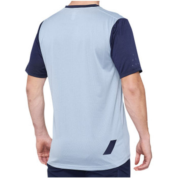 Catalog studio image of 100%, Ridecamp Jersey (MTB), SKU 51200231, color options Charcoal/Black, Terracotta/Black, Blue/Navy, sizes SM, MD, LG, XL, Designed for Mountain Bike, BMX and E-Bike riders