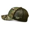 Alpinestars Recon Camo Trucker Hat, SKU 1235-81470, green camouflage pattern, left side view. The hat shows the curved bill, structured crown, and the Alpinestars logo on a patch on the side of the dark green mesh. This is essential gear for any motocross fan.