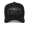 Alpinestars Focus Trucker Hat SKU 4827638 in all black with tonal gray embroidered Astars logo patch on front, snapback motocross cap with curved brim.