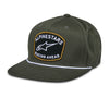 Alpinestars Promptus Snapback Hat, SKU 1235-81445-690-OS, in military green, shown from a front-quarter view. This motocross headwear features a flat bill with a white rope detail and a patch with white text and a black and gold outline.