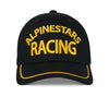 SKU 4827640 Alpinestars Luminary Hat in black and yellow, angled side view displaying curved brim with yellow contrast piping and Alpinestars star logo embroidery, motocross snapback cap.