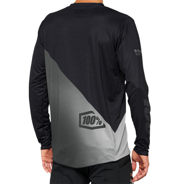 Detailed studio photograph of 100%, R-Core X Jersey (MTB), SKU 50200087, color Black/Gray, sizes SM, MD, LG, XL, 2X, Designed for Mountain Bike, BMX and E-Bike riders