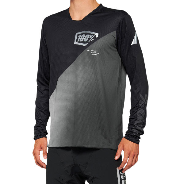 Studio product photo on a neutral background of 100%, R-Core X Jersey (MTB), SKU 50200086, color Black/Gray, sizes SM, MD, LG, XL, 2X, Designed for Mountain Bike, BMX and E-Bike riders