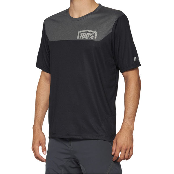 Detailed studio photograph of 100%, Airmatic Jersey (MTB), SKU 50200065, color options Black/Charcoal, Gray/Midnight, sizes SM, MD, LG, XL, Designed for Mountain Bike, BMX and E-Bike riders