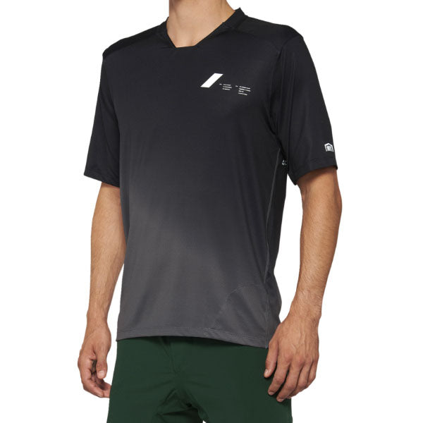 Studio photo showcasing 100%, Celium Jersey (MTB), SKU 50200067, color Black/Charcoal, sizes SM, MD, LG, XL, Designed for Mountain Bike, BMX and E-Bike riders