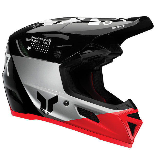 Studio view of Thor Thor - Reflex Sport Strike MIPS Helmet helmet, in Black and Red, MIPS-equipped, vented chin bar and intake ports, on a clean white background, for motocross / off-road use, (SKU 011087) Colors: Black and Red, Navy and Acid Sizes: 2XL, LG, MD, SM, XL, XS