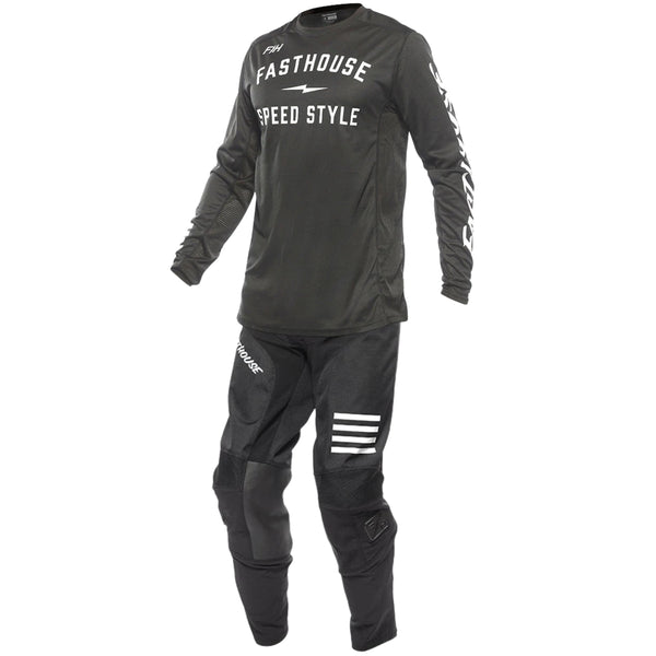 Black motocross outfit with 'Fasthouse Speed Style' branding on a white background