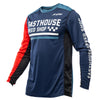 Fasthouse Grindhouse Hudson Jersey (SKU: 3931202104) in Blue and Red colorway, shown in a sharp front-facing image. Features race-fit cut, tapered sleeves, round collar, and bold sublimated graphics. Lightweight motocross jersey designed for dirt bike, ATV, and UTV riders.