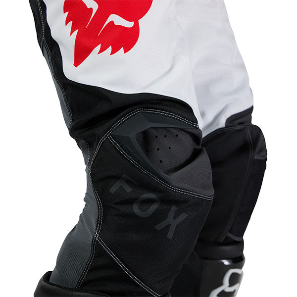Action pose with Black/White 180 Flow Pants (SKU: 33703-077), showing fit and mobility
