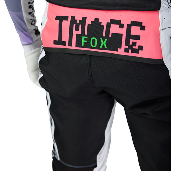 Full-body rider view wearing Fox Racing Flexair Grid Pants in Black and Purple (SKU: 33546-166), showing fit and mobility