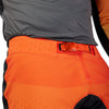 Full-body rider view wearing Fox Racing Flexair Grid Pants in Black and Orange (SKU: 33546-016), showing fit and mobility
